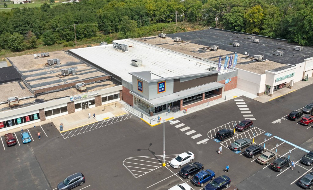 Aerial view of a neighborhood strip retail center and parking