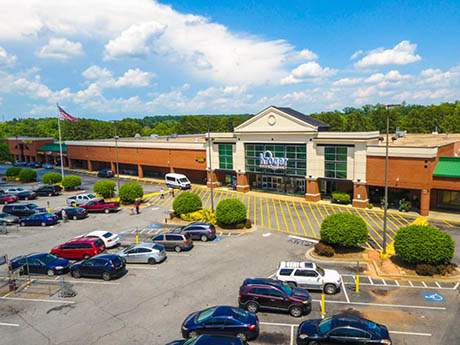 Retail center exterior relevant to reconciling NOI and operating expenses