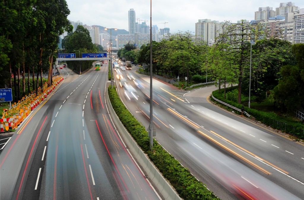 Road and retail corridor suggesting movement between metro markets
